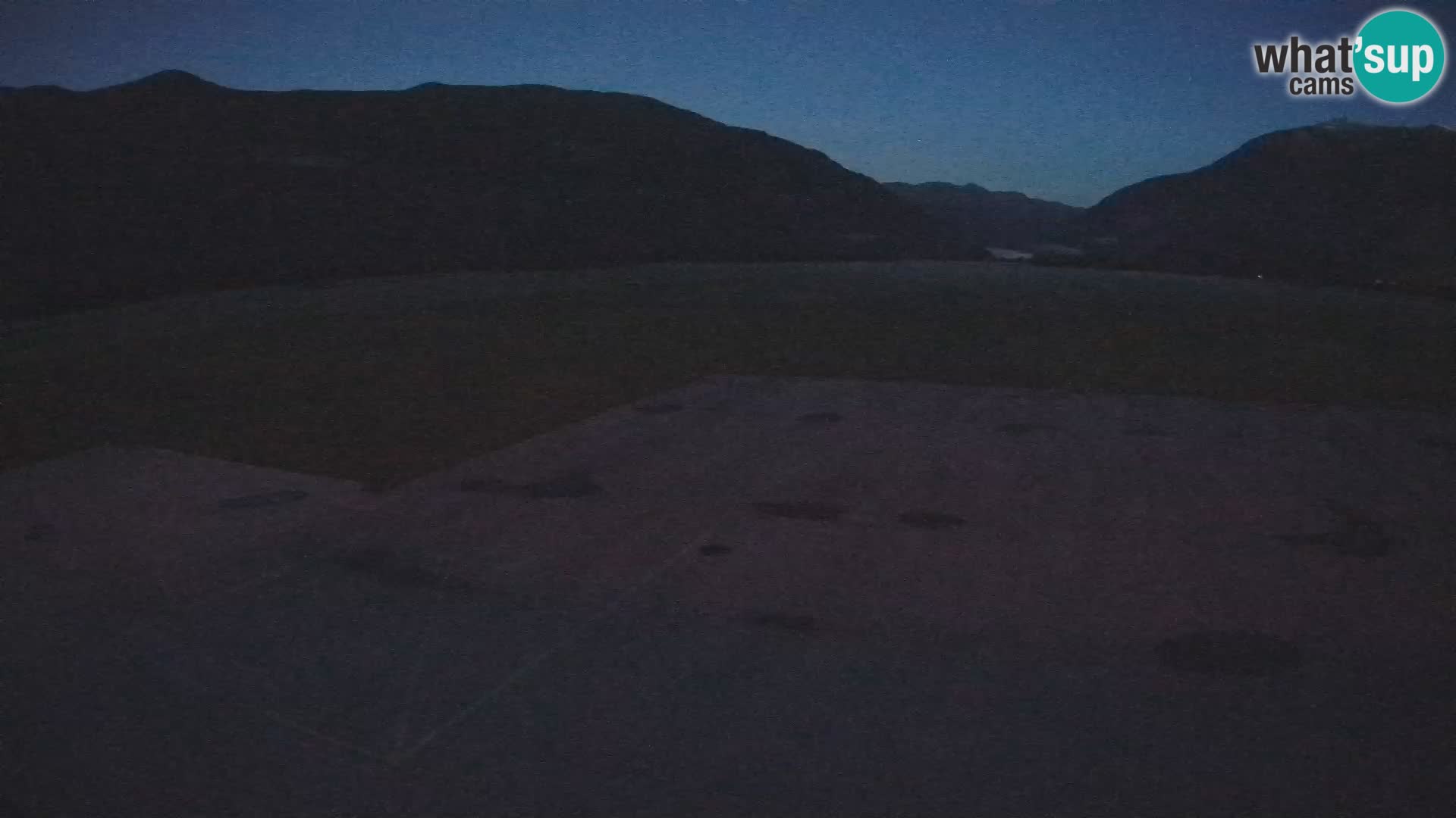 Webcam aereoporto di Bovec (Plezzo) – Vista verso il Kanin